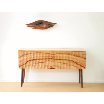Sheer cabinet with walnut wall sculpture