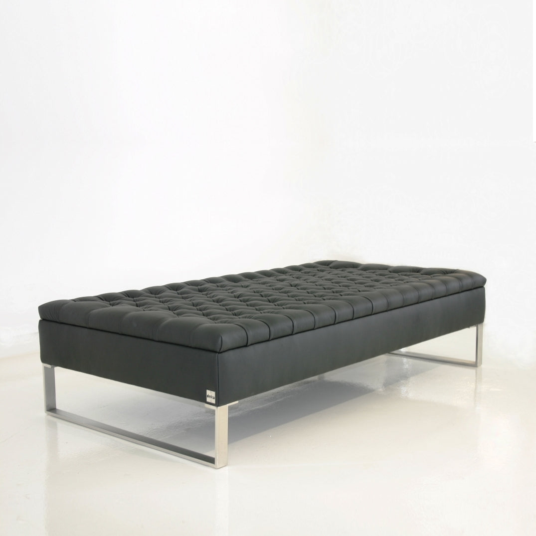 Buttoned leather bench by Deka